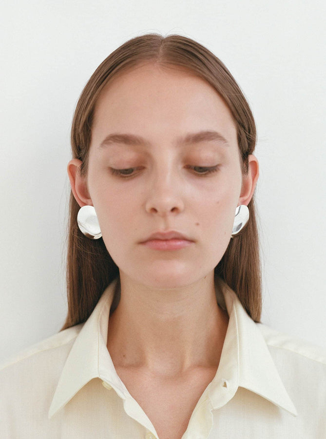 Nina Gordon Stud Earrings Dented Medallion Earrings Shop Nina Gordon's Dented Medallion Earrings in Silver